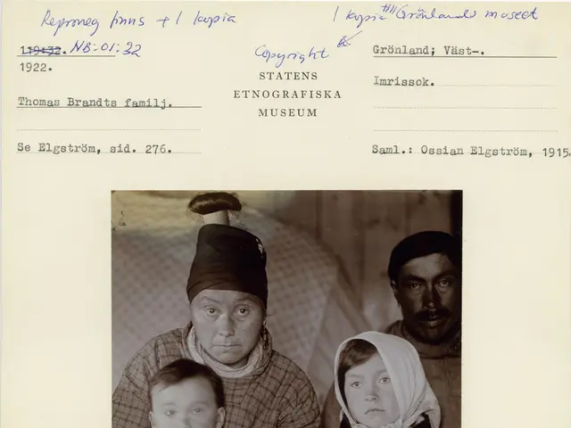 The image shows a black and white photo of a family of three, with the man in the center holding a...